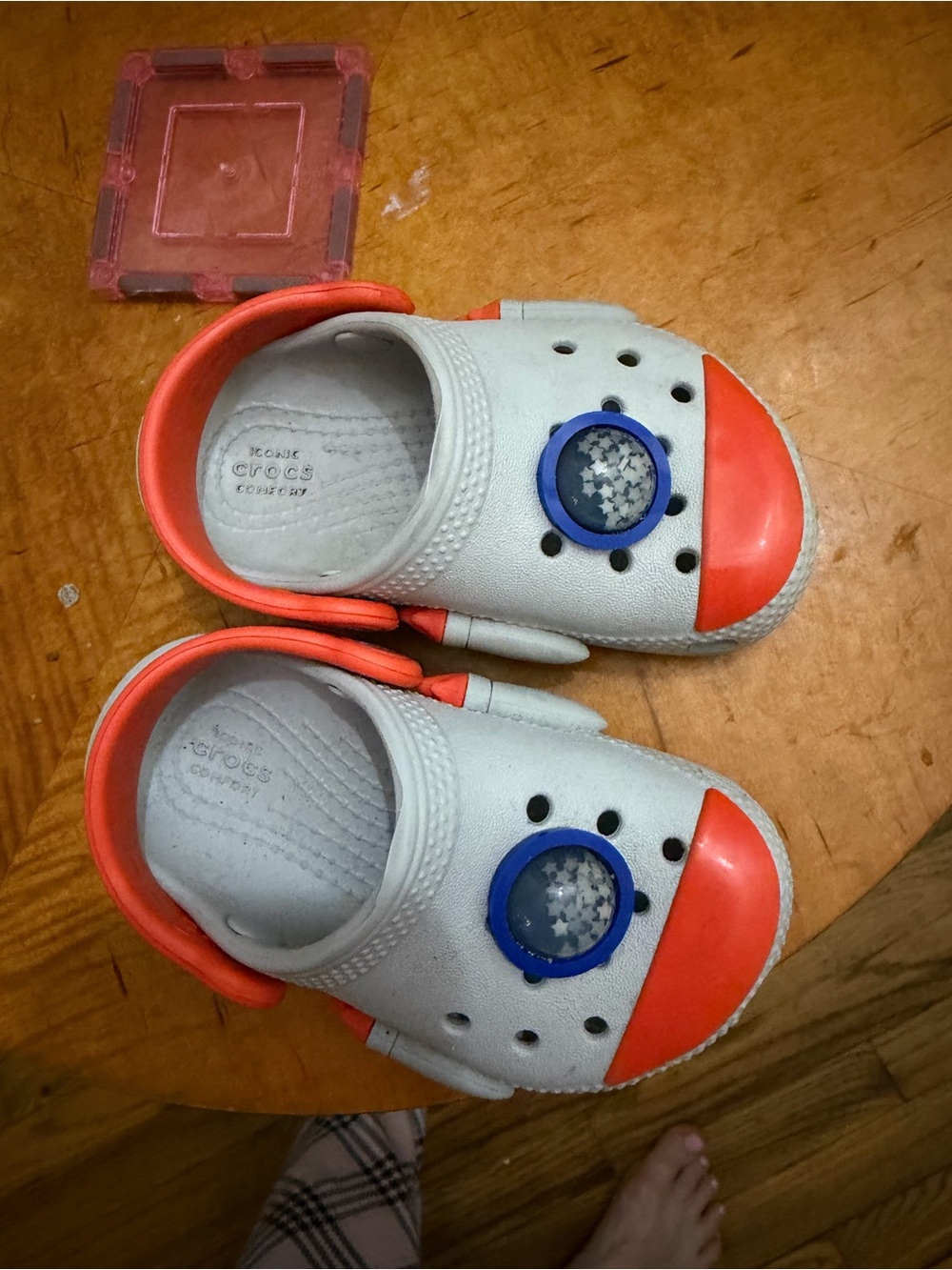CROCS Kids White Clogs with Orange Accents and Blue Charm